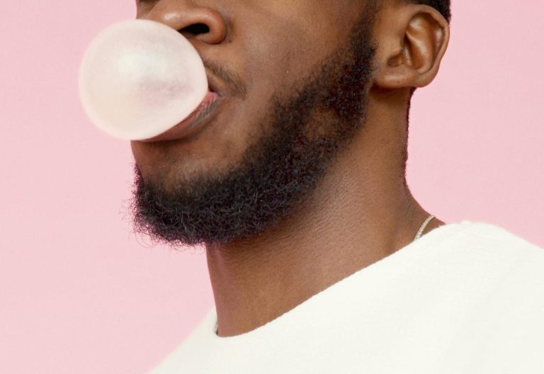 Bearded man in a white shirt blowing a bubble gum. Image used for representational purposes only. PHOTO/Pexels