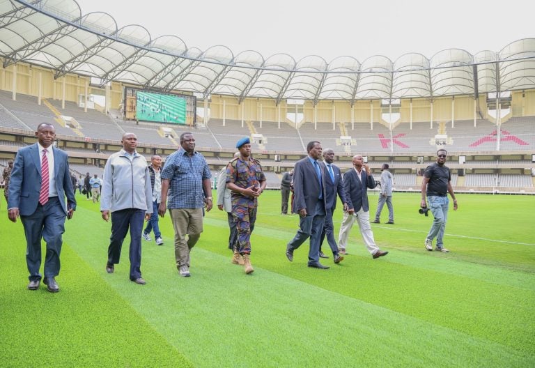 Sports Cabinet Secretary Salim Mvurya (in blue checked shirt) and PS Elijah Mwangi (on his right) lead the Local Organising Committee (LOC) during the handing over of the Moi International Sports Centre, Kasarani, on June 30, 2025. PHOTO/@Waziri_Mvurya/X