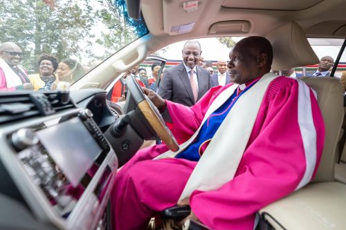 A bishop driving a car after being awarded by Ruto. PHOTO/@WilliamsRuto/X
