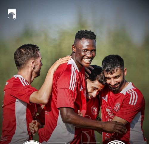 Olunga and his Al Arabi teammates celebrate a goal.
