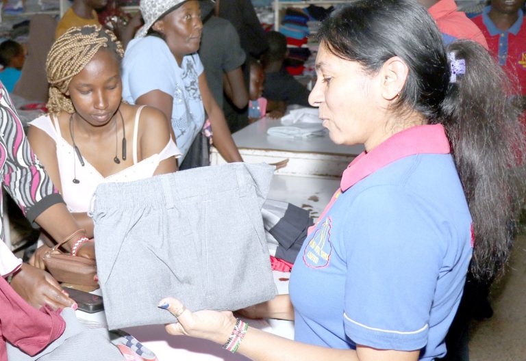 Parents buy items for their children at a Nakuru shop in January 2025 in readiness for the reopening of schools. PHOTO/Raphael Munge