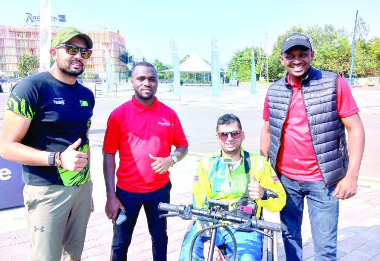 Karan Patel (left) and Nikhil Sachania (second from right) in Rwanda. PHOTO/Sport Picha