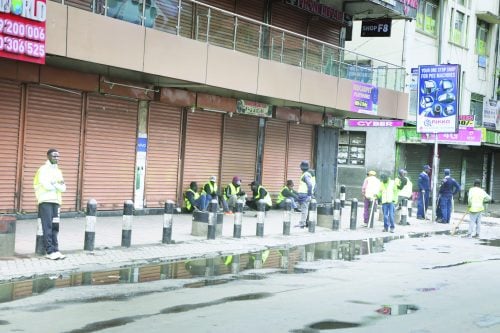 Nairobi business owners guard their shops in the city centre on July 7, 2025. The heightened vigilance came in response to fears stemming from what happened during the June 25 anti-government protests and the economic losses caused by opportunistic looters. PHOTO/Bernard Malonza