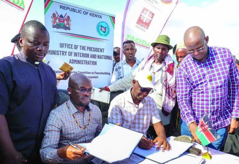 Internal Security PS Raymond Omollo (seated left) during the signing of the Gabra-Daasanach Peace Accord in Illeret, Marsabit county, on July 2, 2025.  PHOTO/Ministry of Interior