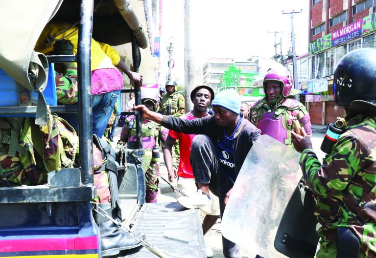Protesters being bundled into the police vehicle after he was arrested during the Saba Saba demonstrations in Nakuru on June 7, 2025.  PHOTO/Raphael Munge