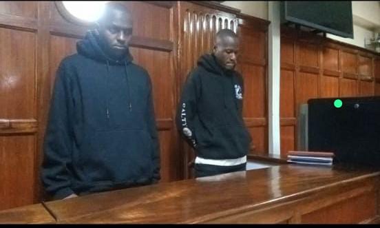 Constables Klinzy Masinde Baraza and Duncan Kiprono when they appeared at the Milimani Law Courts before Principal Magistrate Benmark Ekhubi on Thursday, July 3, 2025. PHOTO/Zipporah Ngwatu