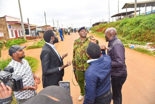 Ndegwa Njiru and Senator Methu talking to an officer during the incident. PHOTO/https://www.facebook.com/JohnMuhiaMethu