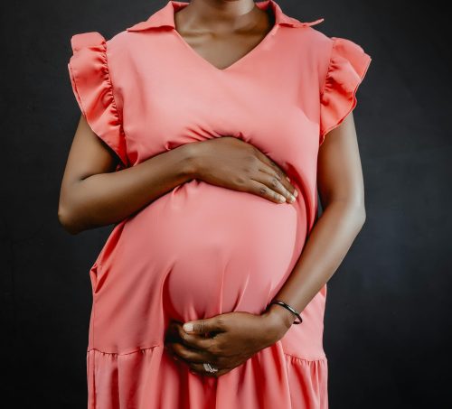 Portrait of a pregnant woman in pink dress. Image used for illustration purposes only. PHOTO/Pexels