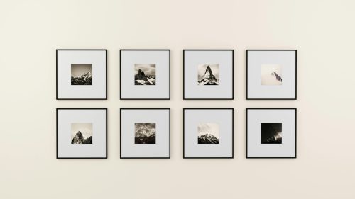 Assorted pictures near décor on wall. Create a gallery wall. PHOTO/Pexels