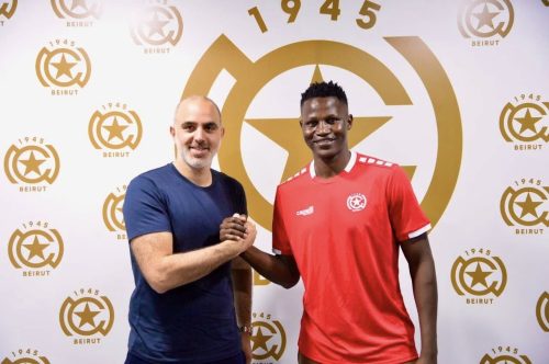 Akumu after signing with the Lebanese side. PHOTO/https://www.facebook.com/Nejmeh SC