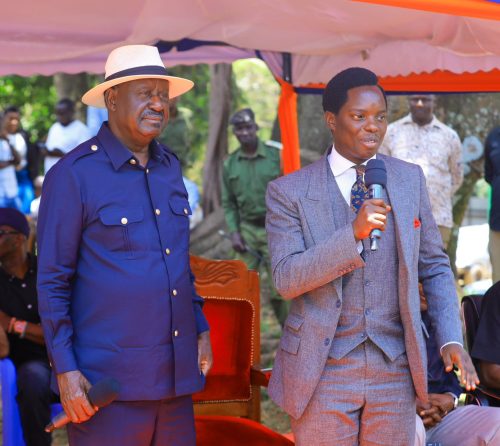 ODM Youth League leader Kasmuel McOure with ODM Leader Raila Odinga. PHOTO/@_KasKazini/X