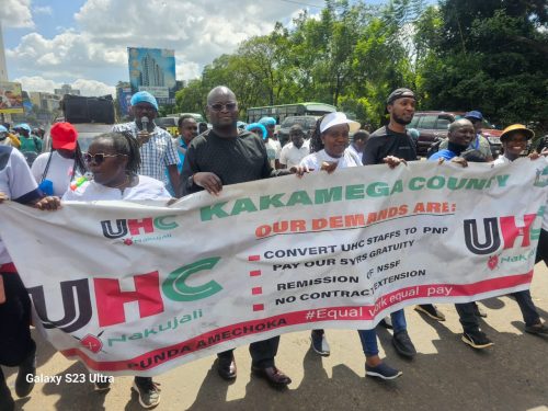 KNUN officials march with a banner. PHOTO/@KNUNOFFICIAL /X