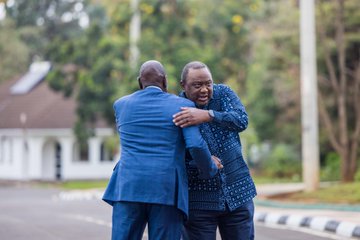 William Ruto exchanging a hug with former president Uhuru Kenyatta while touring him around the State House moments after the EAC-SADC meeting. PHOTO/@WilliamsRuto/X