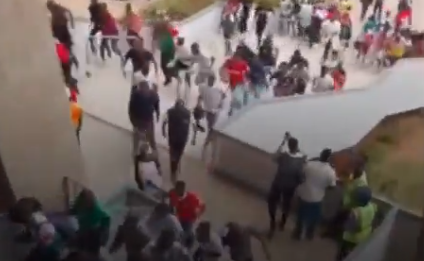 Fans force their way into the stadium. PHOTO/Screengrab by People Daily Digital