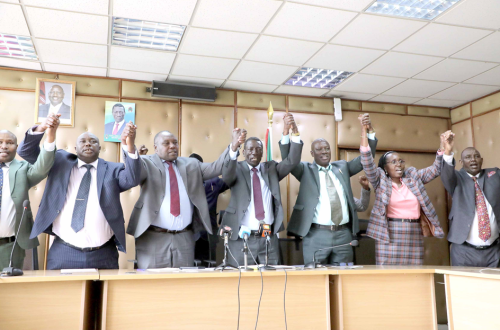 KNUT Gecretary General Collins Oyuu (centre) leads the union’s officials in singing a solidarity song after a press briefing in Nairobi on June 1, 2025 when the union issued a seven-day strike notice over unresolved issues. PHOTO/Bernard Malonza