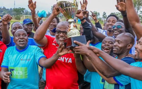 Bunge FC captain and Mombasa senator Mohammed Faki (in red) lifts the trophy after beating the Council of Governors during a friendly match in Homa Bay on August 12, 2025. PHOTO/https://web.facebook.com/ParliamentKE