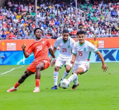 Harambee Stars midfielder Manzur Suleiman (L) battles for the ball against Morocco players during a CHAN group fixture Kasarani Stadium on Sunday, August 10, 2025. PHOTO/https://www.facebook.com/100063913291982/posts/pfbid02KFkLbEg2fAK6313Sgp2eqYn2tUgtrENzBomvP5yLZ1ajEtpzr3EWnyHvBTpG5unPl/?app=fbl