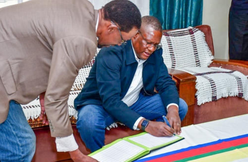 Eliud Owalo signs a condolence book at the home of the late Bob Jalang'o. PHOTO/@EliudOwalo/X