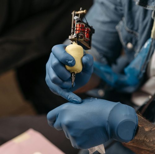 A tattoo artist with latex gloves on. Image used for representational purposes only. PHOTO/Pexels