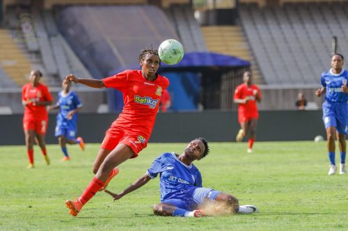 Emily Morang’a past a defender with the ball during the match. PHOTO/https://www.facebook.com/KENYA Police Bullets FC