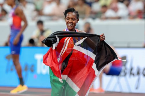 Faith Kipyegon celebrates with the Kenyan flag after winning the 1500m final in Tokyo. PHOTO/@athletics_kenya/X