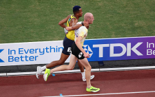 Athlete sacrifices his own race to help injured competitor in World Championship