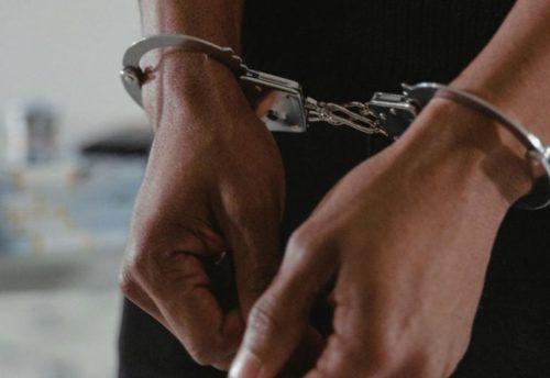 A person in handcuffs. Image used for illustration purposes. PHOTO/Pexels