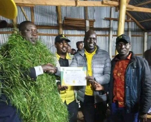 Reuben Kigen Tobosei receiving UDA nominations certificate from the party’s returning officer. PHOTO/Emmanuel Kipkorir
