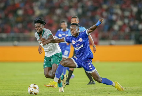 Gor Mahia midfielder Austin Odhiambo (left) battles for the ball during the friendly match in Tanzania on September 10, 2025. PHOTO/https://web.facebook.com/GorMahiafcofficial