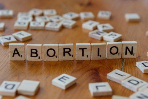 Abortion written on a woed tile, image used for graphical representation only. PHOTO/Pexels