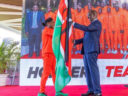 Faith Kipyegon presents the Kenyan flag to the President after a successful Tokyo Championships. PHOTO/https://www.facebook.com/William Samoei Ruto