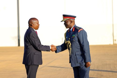 Deputy President Kithure Kindiki shakes hands with a senior military officer before departing for Uganda on Thursday, October 9, 2025. PHOTO/https://www.facebook.com/Kithure Kindiki