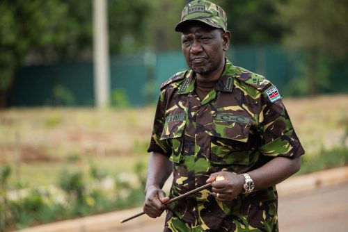 President ruto dressed in a military uniform holding a command button. PHOTO//Statehouse