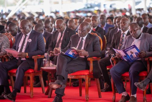 Dougals Kanja sitting close to the president during the burial of his father in Nyeri. PHOTO//https://www.facebook.com/photo/?fbid=1417678719713397&set=pcb.1417687136379222