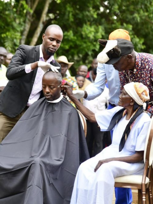 Raila Odinga Junior while being shaved before being coronated as the head of the family. PHOTO//https://www.facebook.com/photo?fbid=1362858391865404&set=pcb.1362858431865400