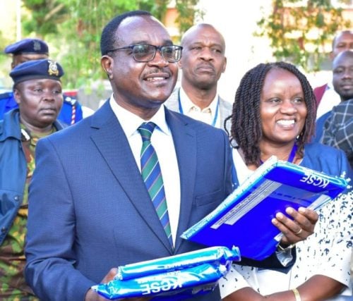 Education CS Julius Migos holding KCSE exam papers for 2024. PHOTO/@HonJuliusMigos/X