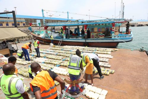 Officials removing seized methamphetamine from the dhow. PHOTO/mod.go.ke