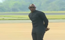Loyal to the end: Raila’s bodyguard Maurice Ogeta seen securing jet carrying his former boss’s body