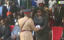 Military hands flag to Mama Ida in final honour to Raila
