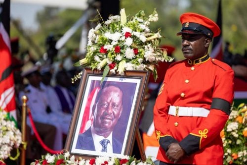 A portrait of Raila Odinga alongside a military officer during his final honours ceremony. PHOTO/railaodinga.go.ke