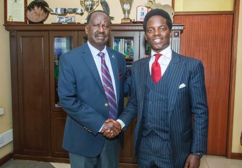 Activist and ODM Youth Leader Kasmuel McOure with late former Prime Minister Raila Odinga during a past event: PHOTO/facebook.com/Kasmuel