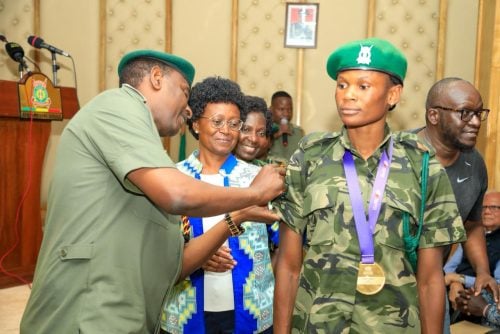 Lillian Odira receiving her promotion from the Kenya Prisons Commissioner General Patrick Aranduh at the Kenya Prisons Service Headquarters in Nairobi on Friday, October 3, 2025. PHOTO/Kenya Prisons Service