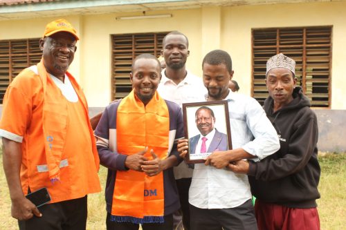 Msambweni branch ODM chair Abdallah Mambo,a member Adnan Juma and their colleagues pose for a photo after meeting at Nyumba Mbovu social hall in Kwale County on Wednesday, October 29, 2025. PHOTO/Shaban Omar