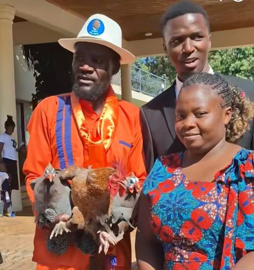 Nuru Okanga with gunea fowls during his condolence visit to Raila Odinga's family. PHOTO//Screengrab by People Daily