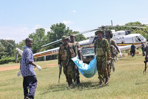Kenya police and military officers carry a body bag from a helicopter during recovery efforts following the Elgeyo Marakwet landslide. PHOTO/@kipmurkomen/X