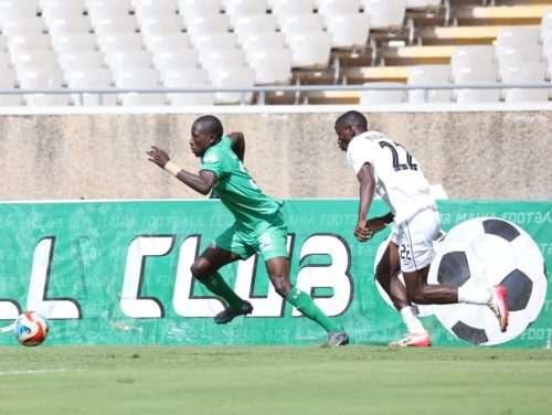 Gor Mahia’s Bryton Onyona and Tusker’s Thomas Omole chase the ball during the league clash at Kasarani. PHOTO/@OfficialGMFC /X