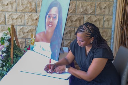 Kanze Dena, Director of Communication and Spokesperson in the Office of the Fourth President, signs the condolence book during a visit to the family of the late Betty Bayo to convey Uhuru Kenyatta’s condolences. PHOTO/@4thPresidentKE/X
