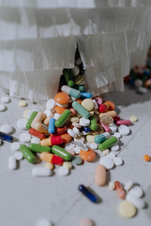 A close-up view of scattered pills in various shapes, sizes, and colors. Image used for illustration purposes only. PHOTO/Pexels