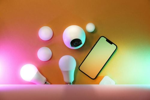 A collection of smart home devices including light bulbs and a smartphone, showcasing modern technology. Photo used for illustration purposes. PHOTO/ Pexels