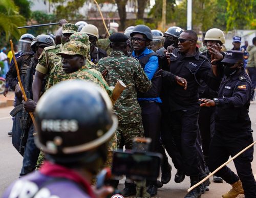 Ugandan opposition leader Bobi Wine surrounded by police and his guards. PHOTO/@HEBobiwine/X